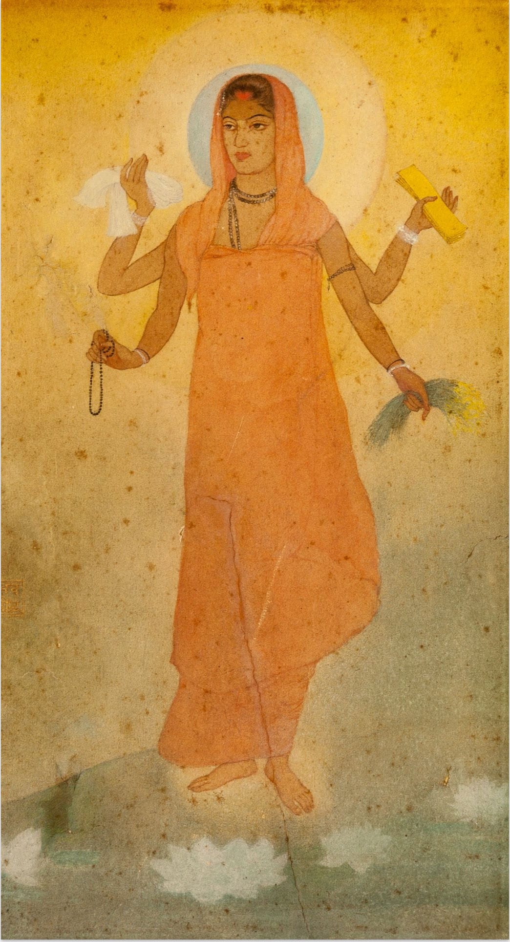 Painted standing bodhisattva with a halo on an Ajanta cave wall