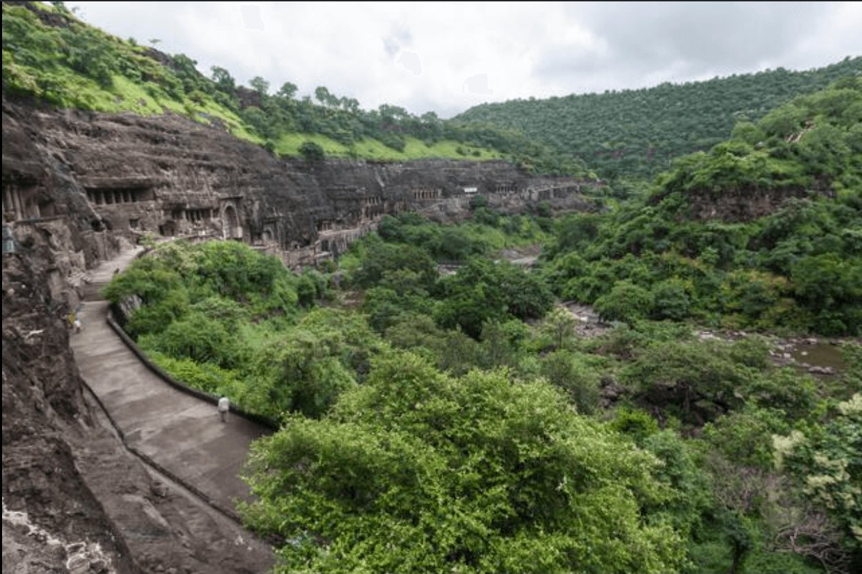 The horseshoe cliff of the Ajanta Caves above the Waghora river valley