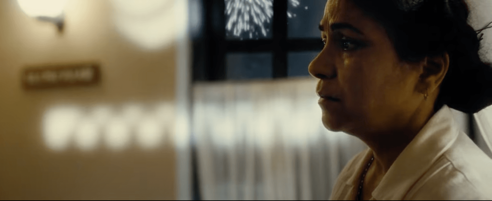 Film still from Midnight’s Children showing a woman in profile