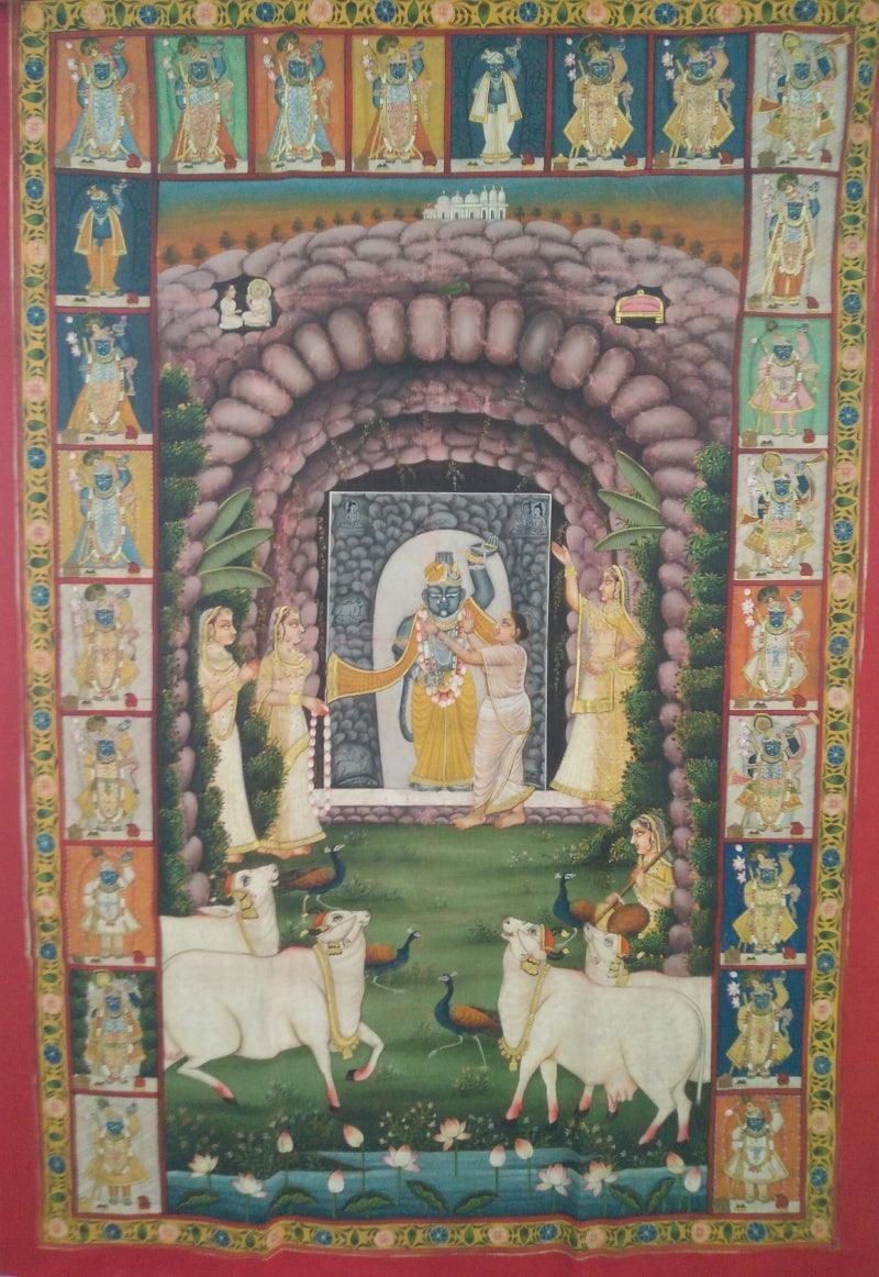 Pichvai of Shrinathji framed by an ornate archway with cows
