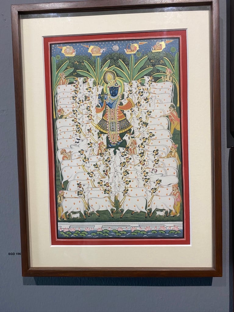 Framed Pichvai painting of Shrinathji on a gallery wall
